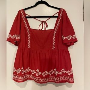 Beautiful red blouse with white stitching